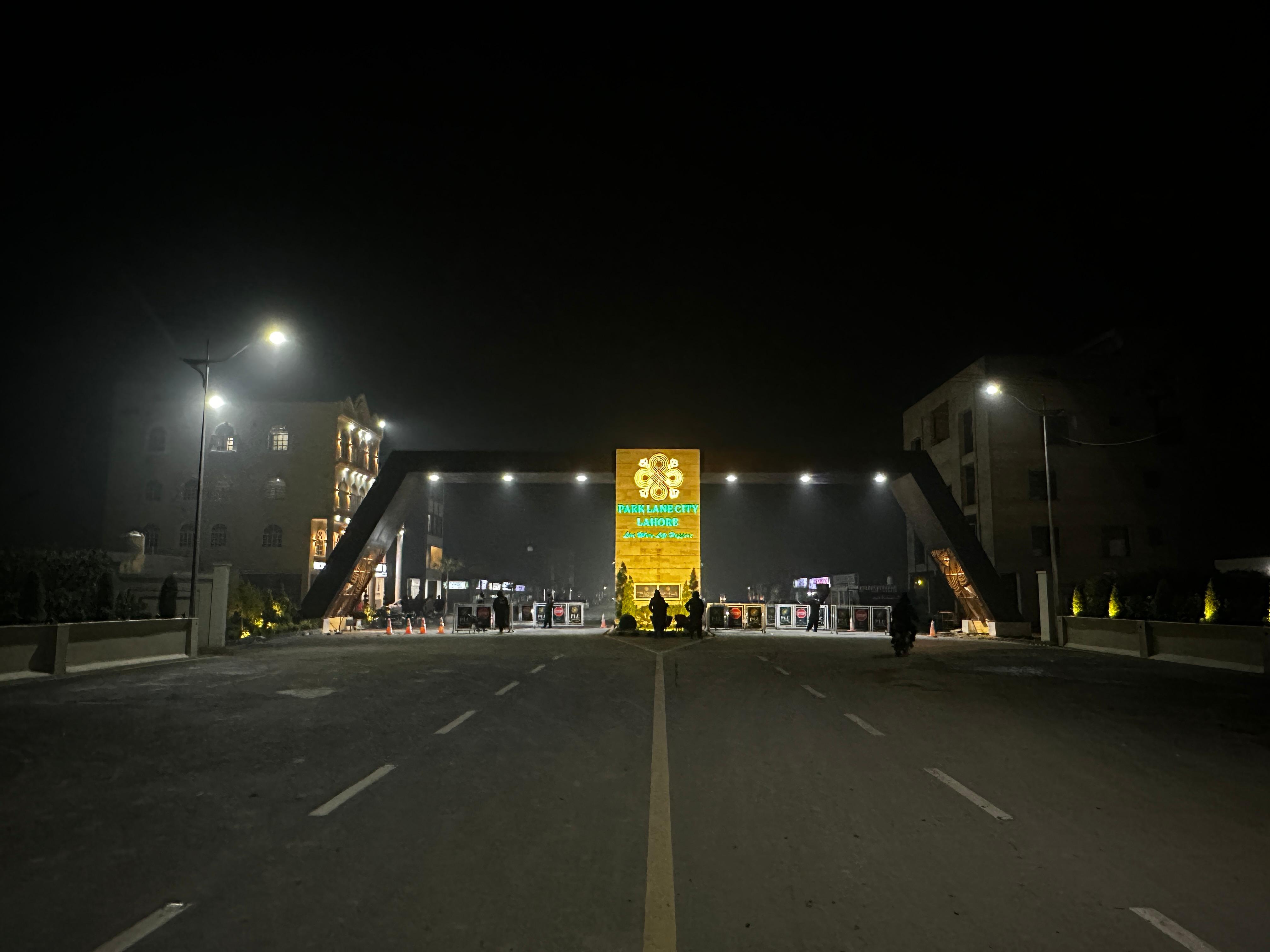 Park Lane City illuminated main gate at night