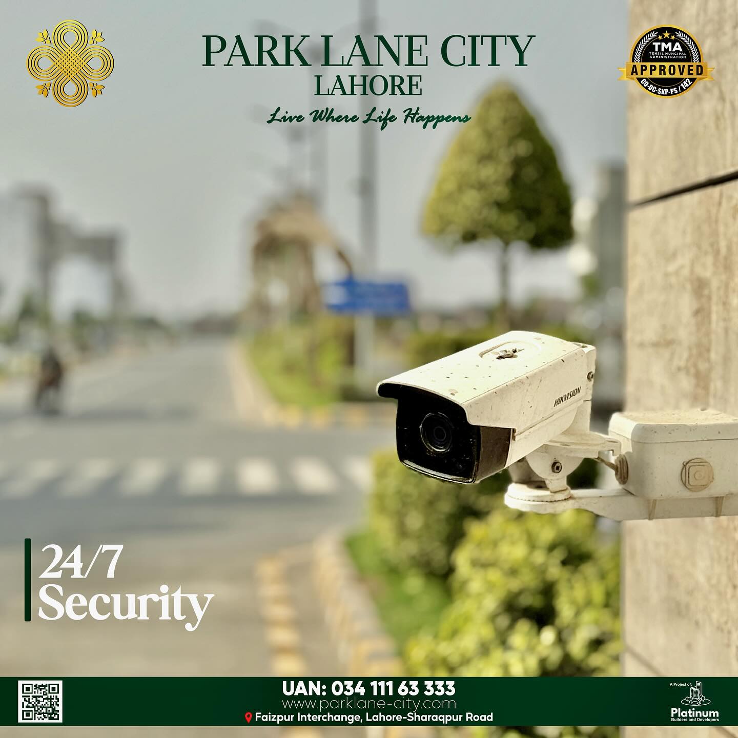 Hikvision CCTV security camera mounted at PLC gate with society road in background